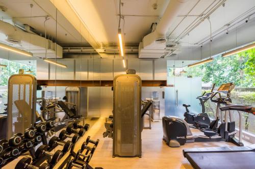 a gym with treadmills and exercise equipment at Hotel Vista in Pattaya Central