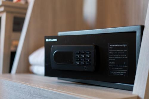 a microwave oven sitting on top of a shelf at Salee Boutique Hotel in Chiang Mai