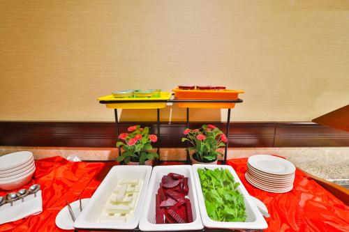 a table with a tray of food on a table at Telal Hotel Apartments in Dubai