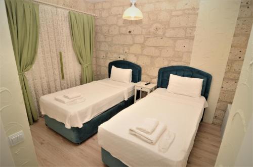 Ένα ή περισσότερα κρεβάτια σε δωμάτιο στο Alacati Eldoris Butik Hotel