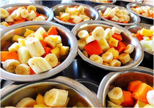 a bunch of bowls filled with different types of vegetables at AYM Yoga Resort Arambol GOA in Arambol