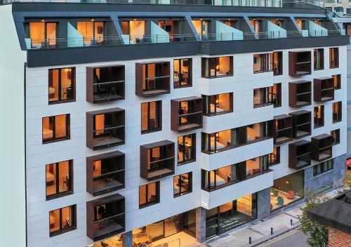 an external view of a building with many windows at Axel Hotel San Sebastián - Adults Only in Donostia-San Sebastián