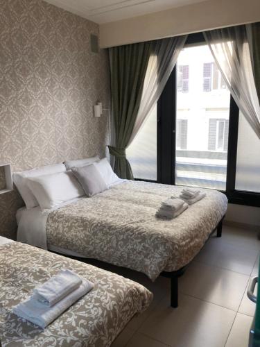 A bed or beds in a room at Visconti apartment.