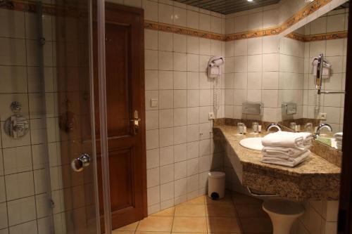Ett badrum på Hotel Le Mandelberg