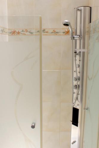 a shower with a glass door in a bathroom at Rachel imenu Duplex Apartment Amazing sea view in Ashdod