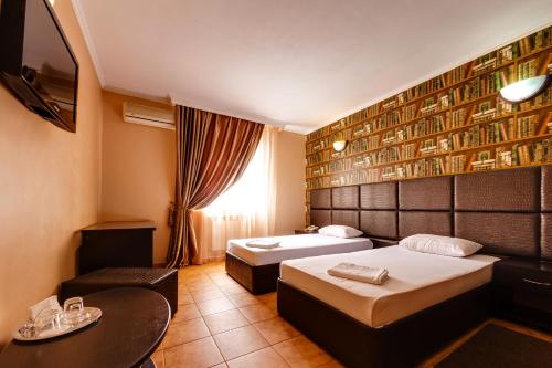 En eller flere senge i et værelse på Villa Mars Krasnodar