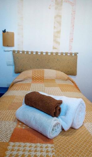 Postel nebo postele na pokoji v ubytování B&B dai Carari