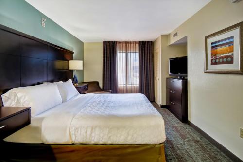 A bed or beds in a room at Staybridge Suites Middleton/Madison-West, an IHG Hotel