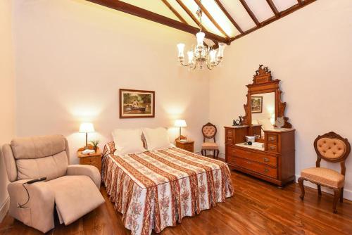 Postel nebo postele na pokoji v ubytování Las Orquideas oldtown house PM60