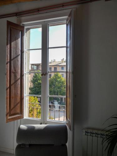an open window with a couch in a room at Luxury Apartment Stancesvic in Vic