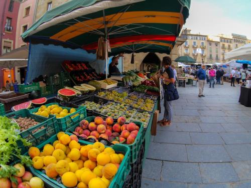 a market with fruits and vegetables on a street at Luxury Apartment Stancesvic in Vic