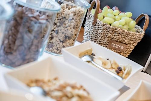 a table topped with boxes of nuts and other snacks at Bed & Breakfast Fender in Sölden