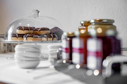 a plate of donuts on top of a shelf at Bed & Breakfast Fender in Sölden