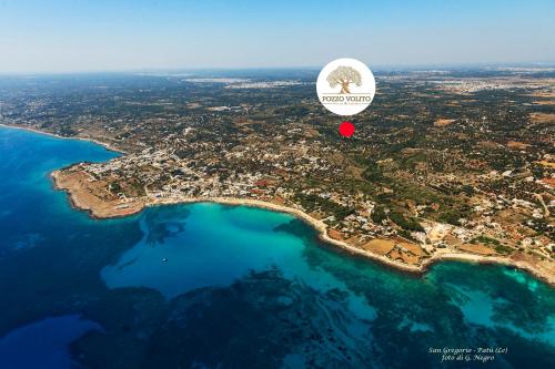 an aerial view of a island with a red circle at "IL BOSCO" di POZZO VOLITO in Patù