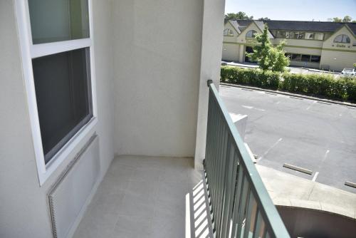 an apartment balcony with a view of a parking lot at Holiday Inn Express Windsor Sonoma Wine Country by IHG in Windsor