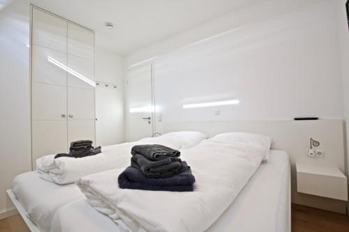 Postel nebo postele na pokoji v ubytování Villa Petersen, Penthouse 09