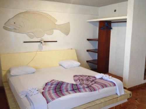 Cama ou camas em um quarto em Safari Inn