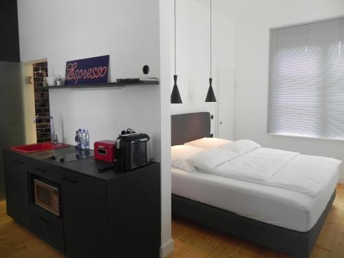 Ένα ή περισσότερα κρεβάτια σε δωμάτιο στο Milchhaus Zimmer - Tiny House