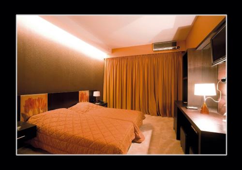 Postel nebo postele na pokoji v ubytování Hotel Cezaria