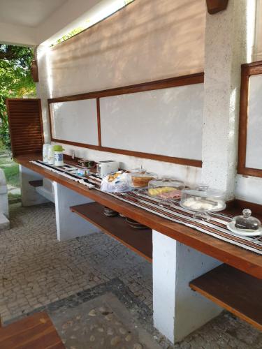 a long counter with food on top of it at Pousada Yuste Beach Farm in Paracuru