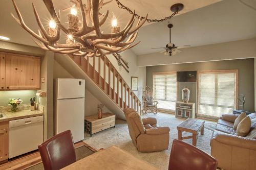 a kitchen and living room with a chandelier at Palisades Tahoe Lodge in Olympic Valley