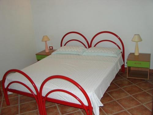 Katil atau katil-katil dalam bilik di Agriturismo Su Tiresi