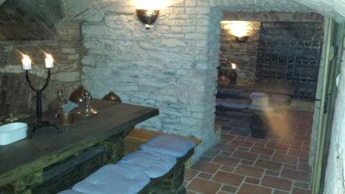 a stone room with a sink and a fireplace at U Anny Šmejdířky in Nymburk