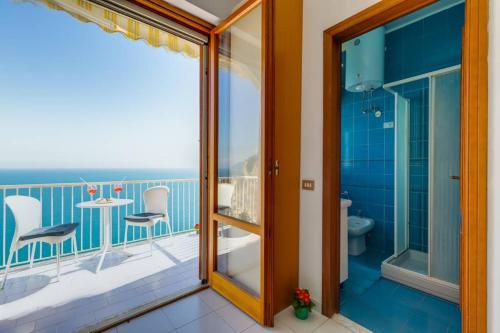 a bathroom with a balcony with a shower and a toilet at Casa mare blu in Amalfi