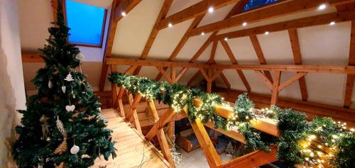a room with a table with christmas trees in it at Sunset House in Ulmale