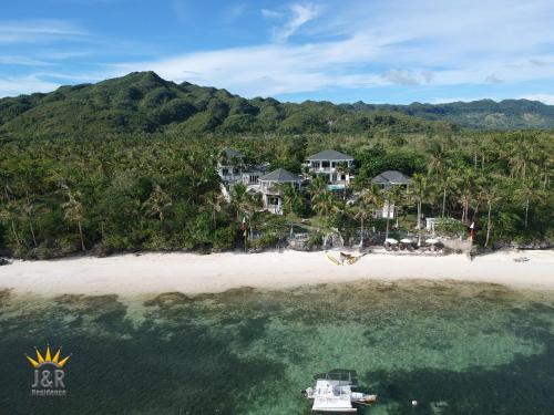 an aerial view of a resort on a beach at J&R Residence in Anda