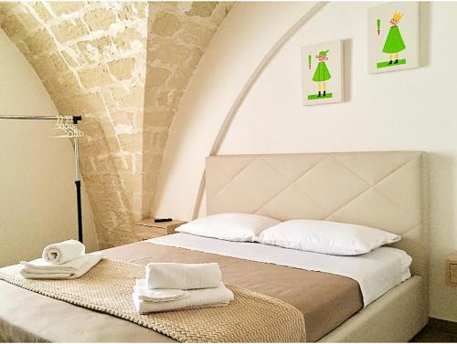 Giường trong phòng chung tại A Quattro di Mazze