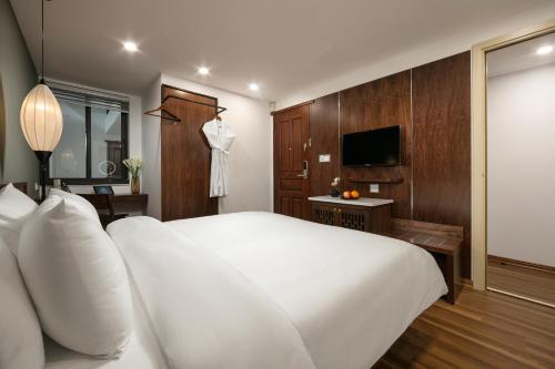 TV a/nebo společenská místnost v ubytování Hanoi Exclusive Hotel