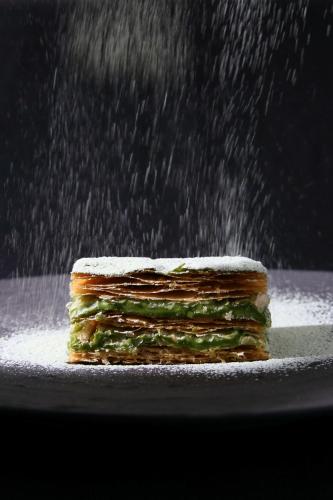 a stack of sandwiches on a plate in the rain at The Landis Taipei in Taipei