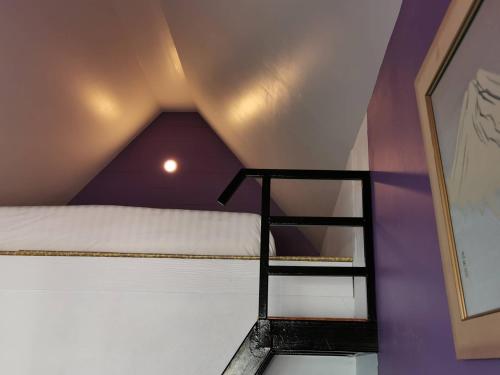 Ένα ή περισσότερα κρεβάτια σε δωμάτιο στο Dozy Lamoon House