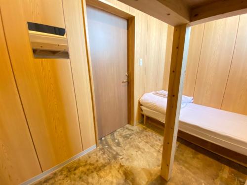 Ένα ή περισσότερα κρεβάτια σε δωμάτιο στο HOTEL&HOSTEL HARU