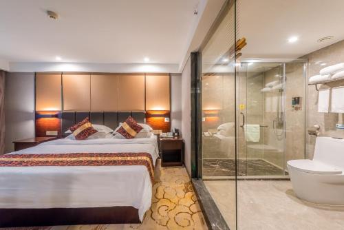Ліжко або ліжка в номері Days Hotel Yishun Guilin