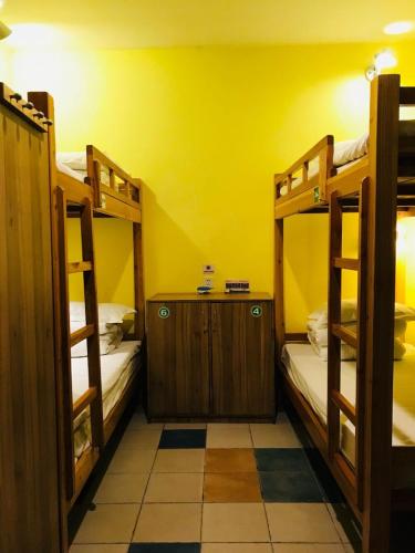 Postel nebo postele na pokoji v ubytování Hofang Guest House
