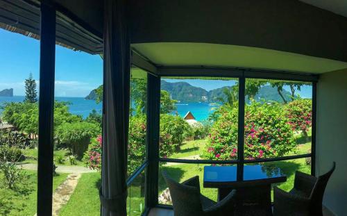a room with a window looking out at the ocean at HIP Seaview Resort @ Phi Phi in Phi Phi Don