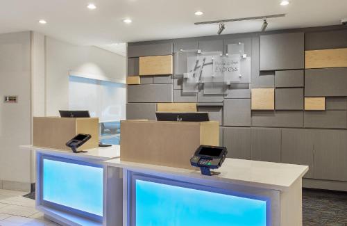 a store with two phones on a counter with boxes at Holiday Inn Express Williamsburg by IHG in Williamsburg