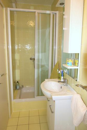 a bathroom with a sink and a shower at Apartment Doder in Pag