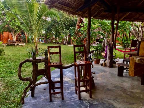 two chairs and a table in a park at Lazy Bones in Koh Rong Sanloem