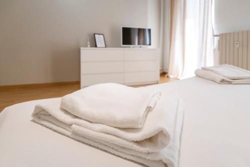 Кровать или кровати в номере Cadorna Apartments