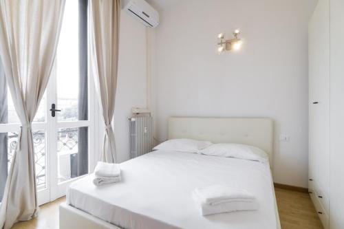 Cadorna Apartments tesisinde bir odada yatak veya yataklar