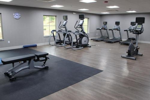 a gym with several treadmills and cardio machines at Holiday Inn Express Shawnee by IHG in Shawnee