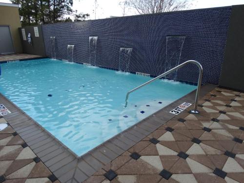 a large pool of water with a metal railing in it at Holiday Inn Covington, an IHG Hotel in Covington