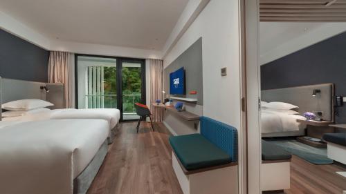 Postel nebo postele na pokoji v ubytování Holiday Inn Express Qiliping by IHG