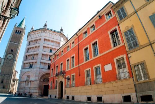 a building with a clock tower and a building with a clock tower at Palazzo Dalla Rosa Prati in Parma