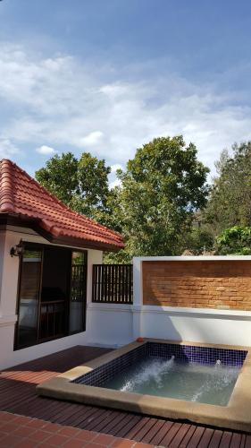 a small swimming pool in front of a house at Casa Khaoyai Bed&Breakfast in Mu Si