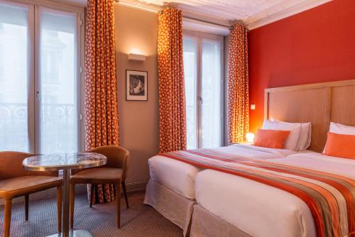 Cama ou camas em um quarto em Hotel 29 Lepic