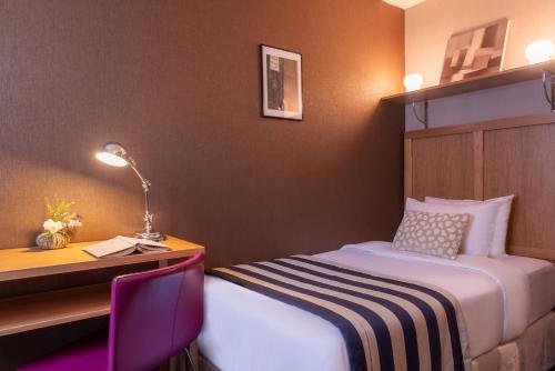 Ένα ή περισσότερα κρεβάτια σε δωμάτιο στο Hotel 29 Lepic